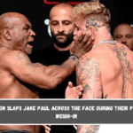 Mike Tyson slaps Jake Paul across the face during their pre-fight weigh-in