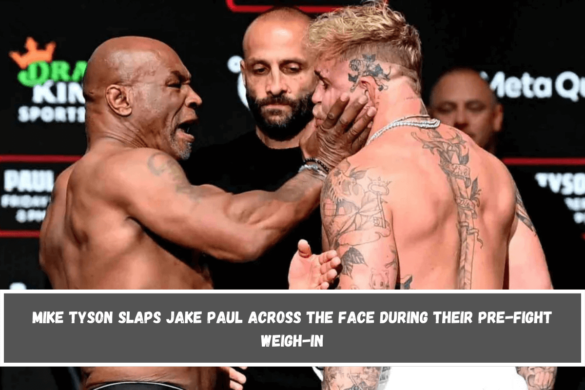 Mike Tyson slaps Jake Paul across the face during their pre-fight weigh-in