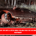 The truck tips into a ditch while pulling over for an emergency responder