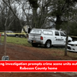 A shooting investigation prompts crime scene units outside the Robeson County home